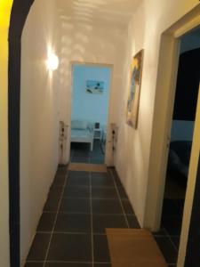 a hallway leading to a room with a hallway at Dar Chick Yahia Ile De Djerba in Mezrane