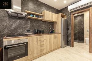 A kitchen or kitchenette at Brand new spacious apartment in sunny St Julians by 360 Estates