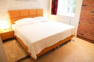 Posteľ alebo postele v izbe v ubytovaní «Go West» guest rooms