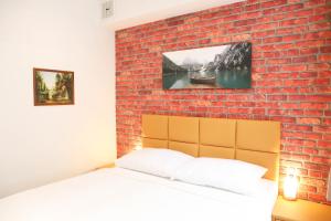 Posteľ alebo postele v izbe v ubytovaní «Go West» guest rooms