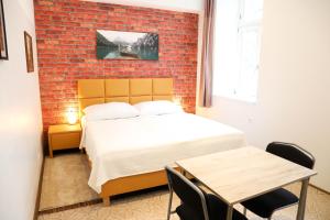 Posteľ alebo postele v izbe v ubytovaní «Go West» guest rooms
