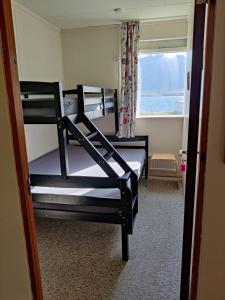 Postel nebo postele na pokoji v ubytování Sólbrekka Guesthouse
