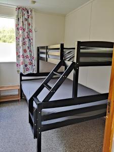Postel nebo postele na pokoji v ubytování Sólbrekka Guesthouse