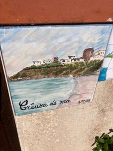 una pintura de una playa en Creúsa de ma Calasetta, en Calasetta