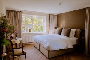 Postel nebo postele na pokoji v ubytování Boetiekhotel De Kastanjehof