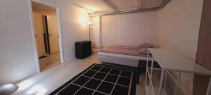 a small room with a bed in a room at Accommodation for working team or big family in Odense