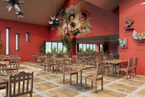 サン・テニャンにあるLes Rivages de Beauvalの赤い壁のレストラン