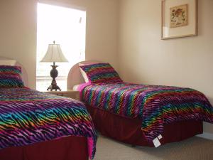 Cama o camas de una habitación en Four Bedroom Villa in Coral Cay