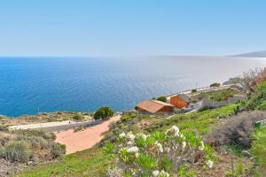 an aerial view of a house on a hill next to the ocean at Casa Luminosa in Bocacangrejo