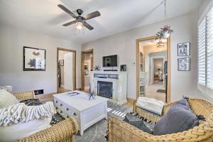 een woonkamer met een bank en een open haard bij Enchanting Reno Retreat with Deck Walk to Midtown! in Reno