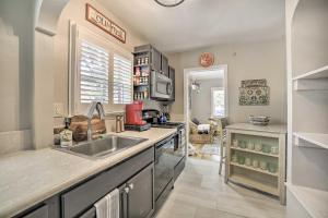 a kitchen with a sink and a counter at Enchanting Reno Retreat with Deck Walk to Midtown! in Reno