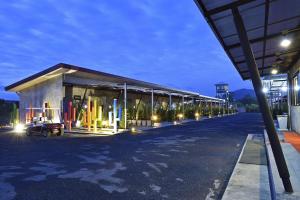 a building with lights on the side of the road at The Oasis Resort in Krabi