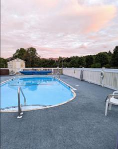 a large swimming pool on top of a house at Gale River Motel in Franconia