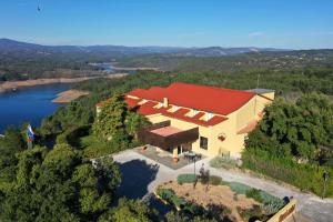 an overhead view of a house with a red roof at Hotel Da Montanha in Pedrógão Pequeno