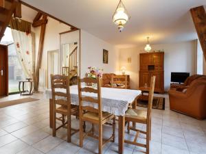 a kitchen and dining room with a table and chairs at Gîte Montagne avec Terrasse et Barbecue - Animaux Acceptés - FR-1-489-101 in Ferrières-sur-Sichon