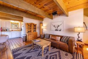 a living room with a couch and a table at Amazing Cabin - Close To Ski Resort and Village in Big Bear Lake