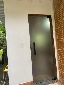 an open door to a building with a door at Pesque pague pousada do Carlinho in Pinheiral
