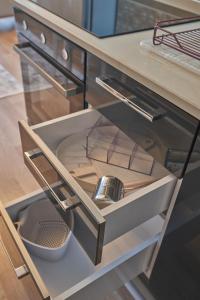an open drawer in a kitchen with a sink at Fully Equiped Apartment In Istanbul Avcilar - Zarif-60 in Avcılar