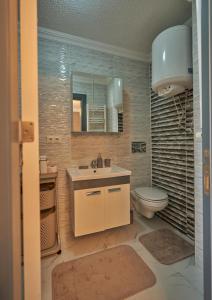 a bathroom with a sink and a toilet at Fully Equiped Apartment In Istanbul Avcilar - Zarif-60 in Avcılar