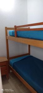 Una cama o camas cuchetas en una habitación  de Chalet MIRAMAR Zona II para 6 Pax