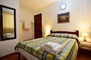 Cama o camas de una habitación en Hotel da Canoa