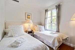 Ein Bett oder Betten in einem Zimmer der Unterkunft Villa Belle Époque - Welkeys