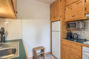 Kuchyňa alebo kuchynka v ubytovaní Appartement Stenoga - Welkeys