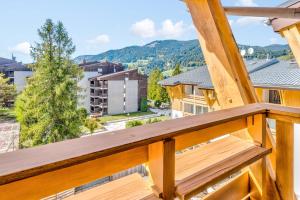 a balcony with a view of the mountains at Charming apartment with view on the Mont Blanc - Welkeys in Megève