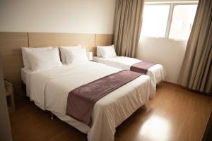 Postel nebo postele na pokoji v ubytování Hotel Franco