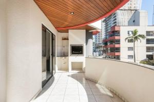a balcony with a view of a building at Itapema Beira Mar in Itapema