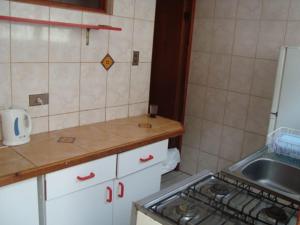a small kitchen with a stove and a sink at casa norma santiago 5 personas in Santiago