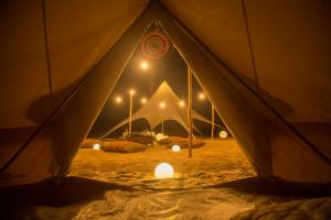 a view from inside of a tent with lights at Duna Camp Huacachina in Ica