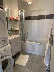 a bathroom with a shower toilet and a sink at CAP SUR SAINT-VAL in Saint-Valery-sur-Somme +24 photos