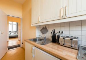 a kitchen with a sink and a counter top at Gästehaus Schwabach in Schwabach
