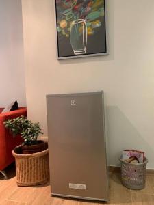 a metal appliance sitting on the floor in a room at Confortable and functional SUITE in MIRAFLORES ! in Lima