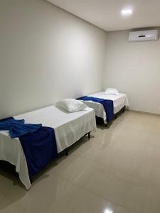 Postel nebo postele na pokoji v ubytování Hotel Cristalina