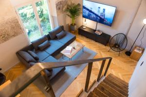 TV a/nebo společenská místnost v ubytování Design Loft I 130 qm I Europapark 20min I 2 Etagen I 2 Bäder I Nespresso I Parkplatz