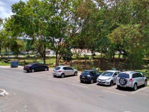 a group of cars parked in a parking lot at STRELART RESIDENCE in Brasilia