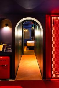 a room with a door leading to a bedroom at Minamina, chambre avec jacuzzi privatif in Roquefort-la-Bédoule