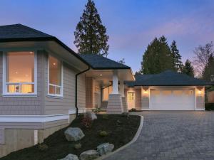 a house with a driveway in front of it at Big 4 Bd, 4 Ba home, Steps to Ocean with EV Charger in Cowichan Bay