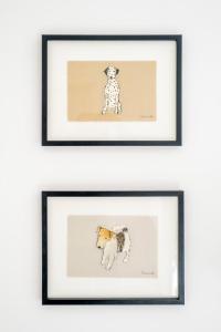 two framed drawings of a dog and a puppy at The Corner House in Thorpeness