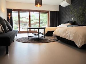 Ένα ή περισσότερα κρεβάτια σε δωμάτιο στο Yadoya Sho - Vacation STAY 13531