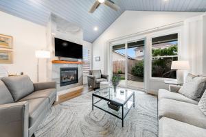 a living room with a couch and a fireplace at Seaside Ocean Getaway in Seaside