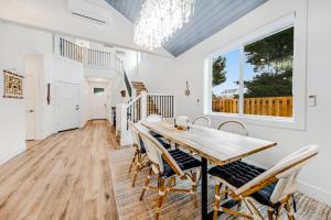 a dining room with a wooden table and chairs at Seaside Ocean Getaway in Seaside