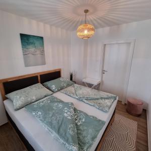 Postel nebo postele na pokoji v ubytování Ferienwohnung Amelie