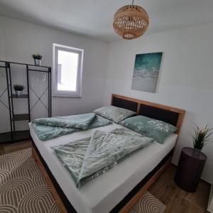 Postel nebo postele na pokoji v ubytování Ferienwohnung Amelie