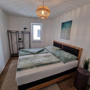 Postel nebo postele na pokoji v ubytování Ferienwohnung Amelie