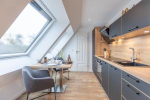 Kuchyň nebo kuchyňský kout v ubytování Getidenhus Lütje