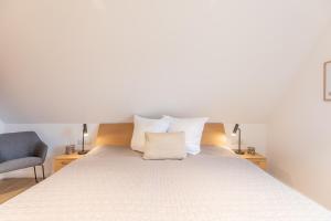 Postel nebo postele na pokoji v ubytování Getidenhus Lütje