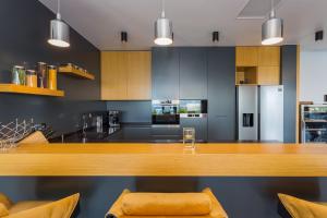 a kitchen with a wooden counter top in a room at Villa Titanium in Opatija